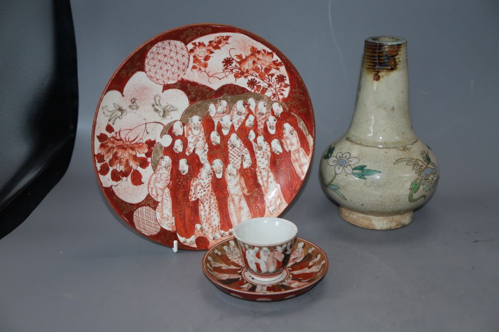 An 18th century Japanese blue and white dish, a studio vase and a Kutani plate and tea bowl and saucer, tallest 20cm